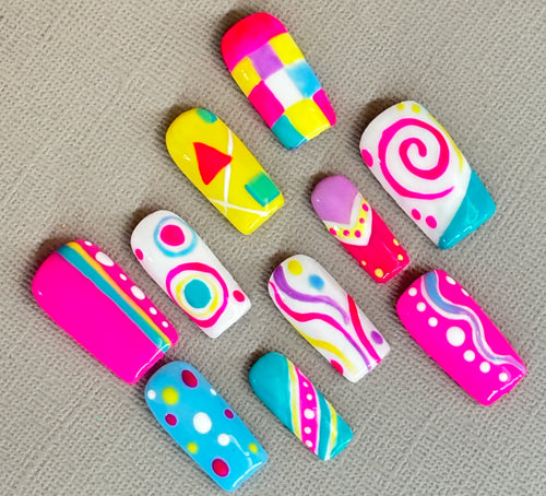 Bubble Pop colourful handmade press-on nails with playful pink, yellow, turquoise and purple designs.